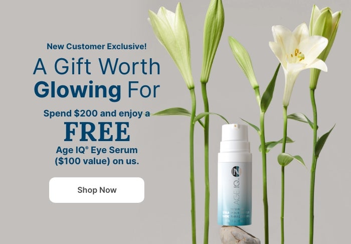New Customer Exclusive: Spend $200 and enjoy a FREE Age IQ Eye Serum ($100 value). Featured is a Age IQ Eye Serum container next to plants.